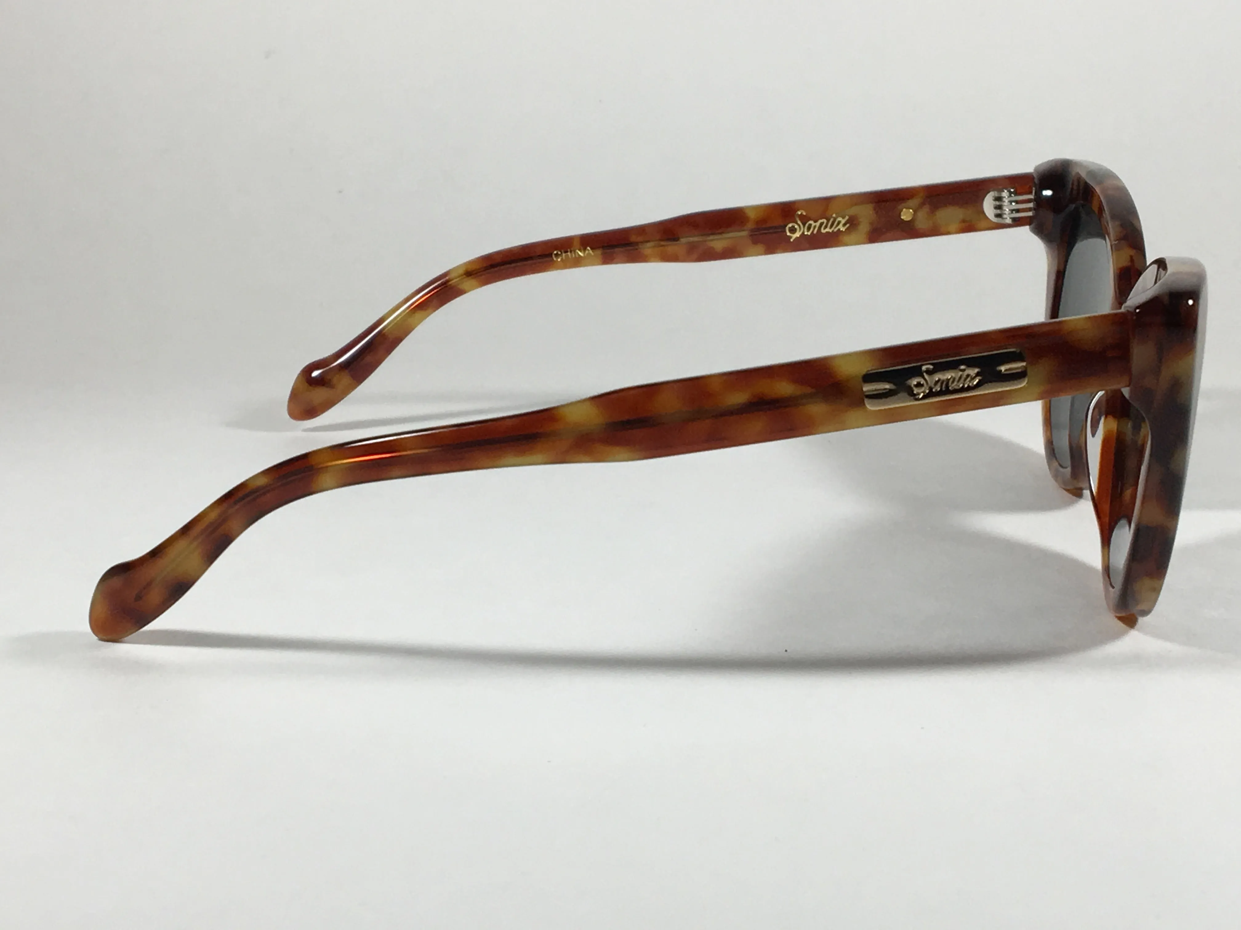 Sonix KYOTO 501-26-012 Sunglasses Women's Cat Eye Brown Tawny Tortoise Frame Green Solid Lens