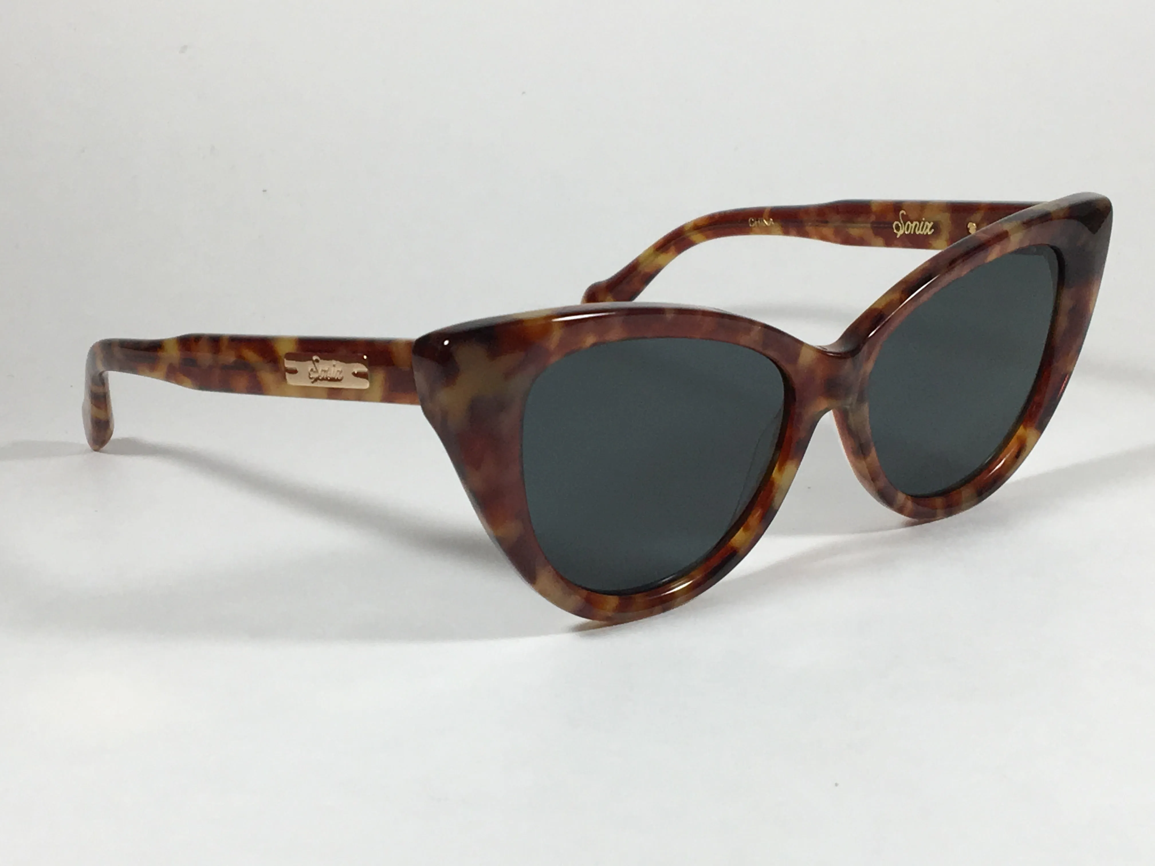 Sonix KYOTO 501-26-012 Sunglasses Women's Cat Eye Brown Tawny Tortoise Frame Green Solid Lens