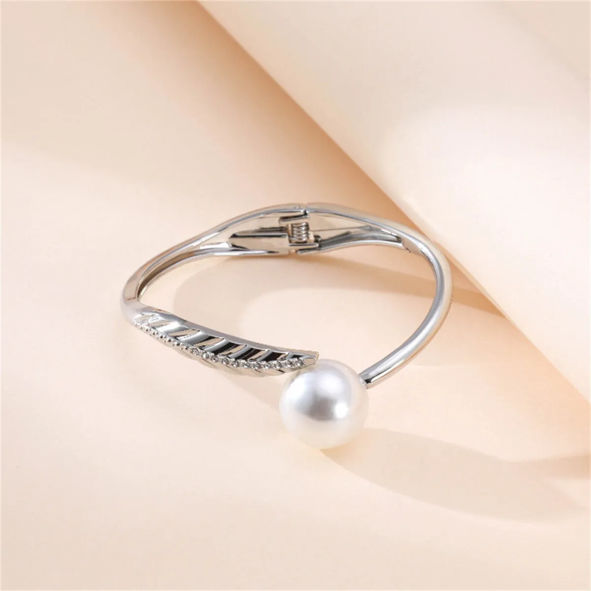 White Pearl & Cubic Zirconia Silver-Plated Leaf Hinge Bangle