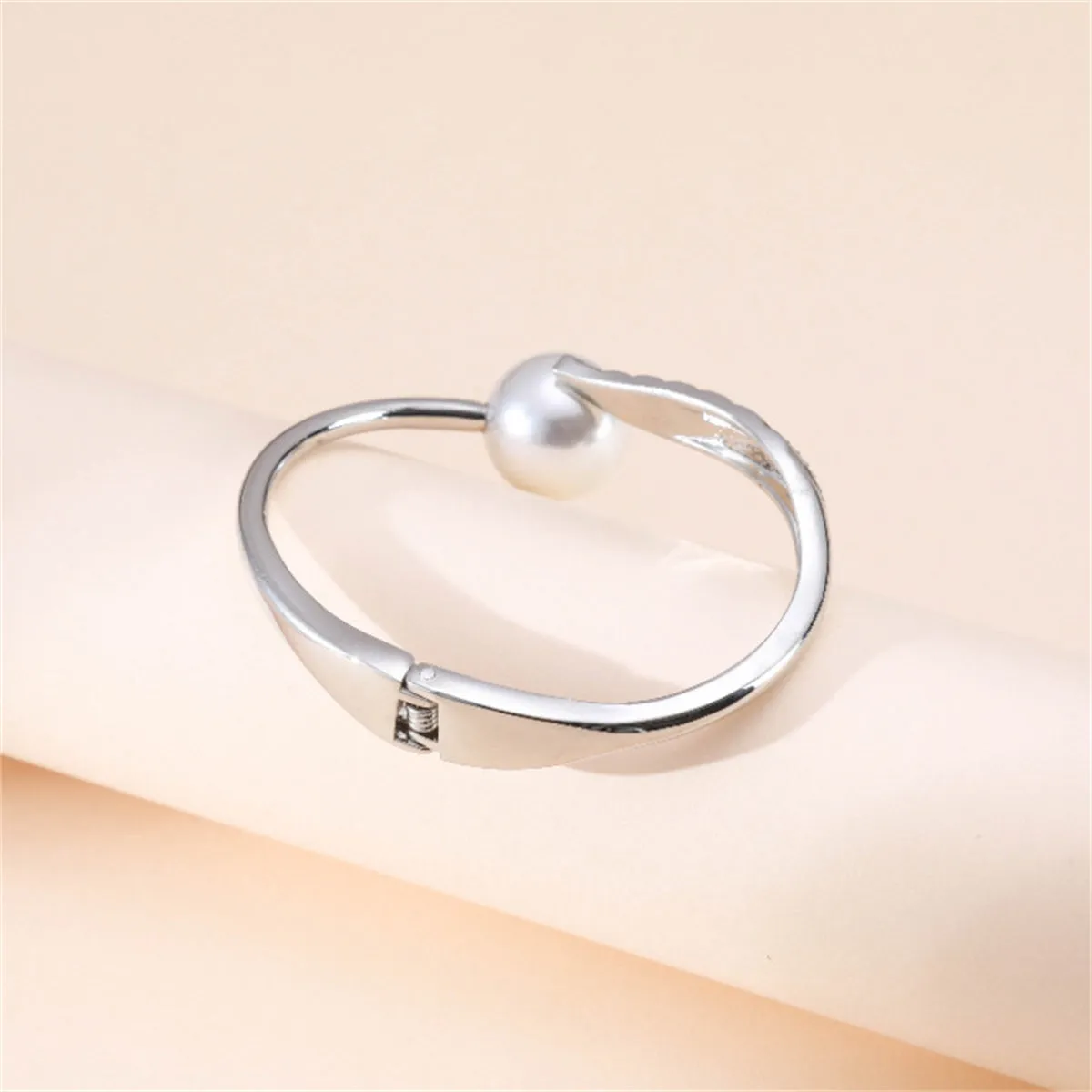 White Pearl & Cubic Zirconia Silver-Plated Leaf Hinge Bangle